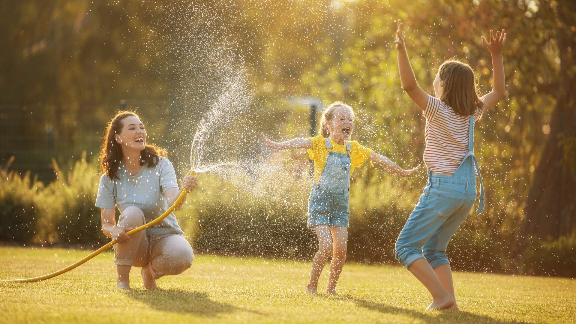 Playing with the hose in the backyard
